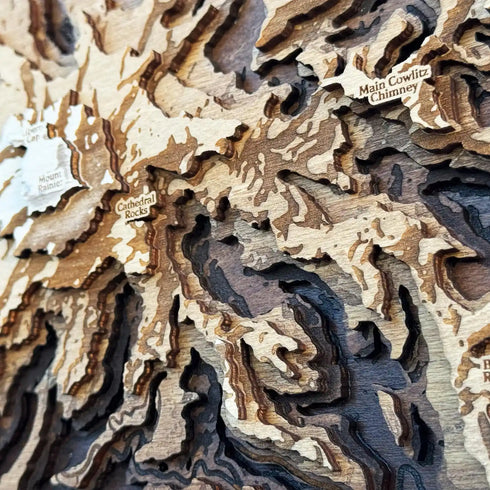 Close-up of laser-cut layers highlighting the rugged terrain of Mount Rainier.