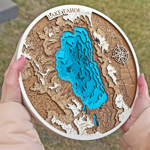 Handmade 3D wooden map of Lake Tahoe with layered bathymetric contours and compass rose