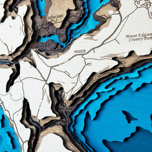 Close-up of Whitsand Bay Fort wooden map with layered topographic details.