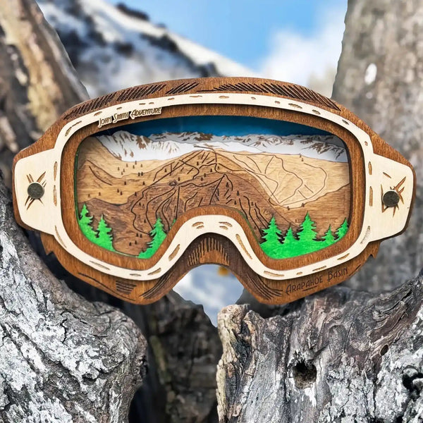 3D wooden trail map of Arapahoe Basin Colorado framed inside ski goggles