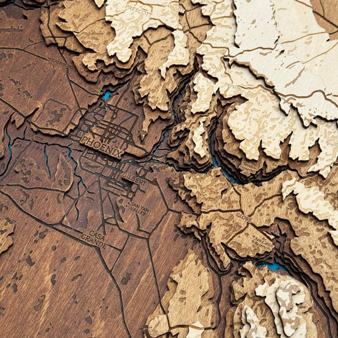 Close-up of handcrafted Arizona wood map with engraved details.