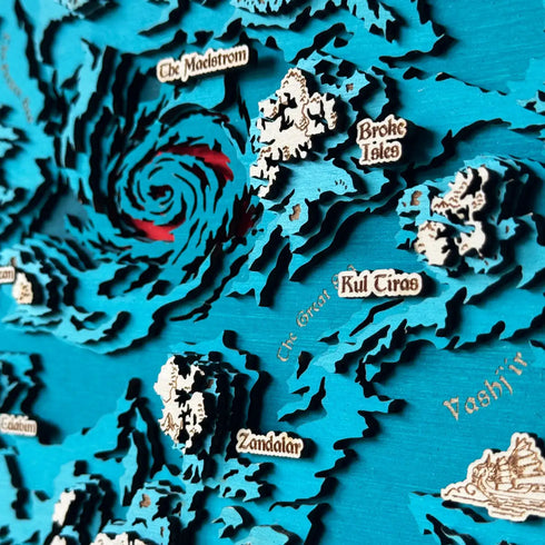 Close-up of laser-cut wooden layers highlighting Kul Tiras and Zandalar.