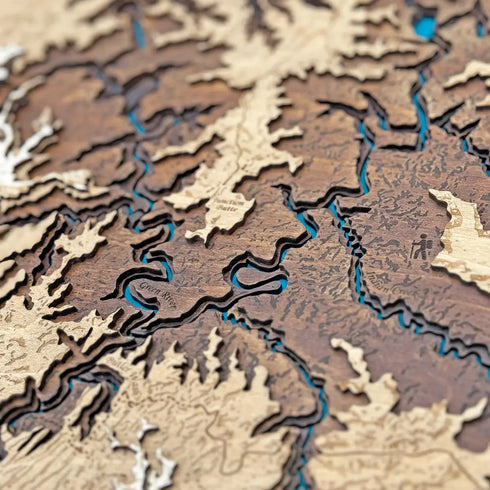 Close-up of Canyonlands wooden map with layered red rock topography