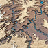 Close-up of Canyonlands wooden map with layered red rock topography