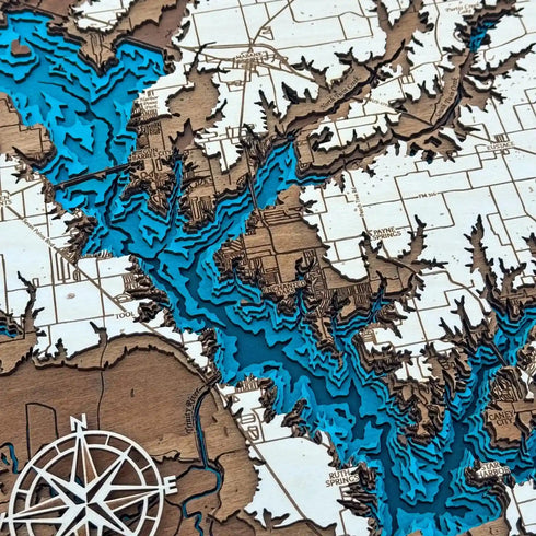 Close up of Cedar Creek Lake wooden map with engraved contours and blue water