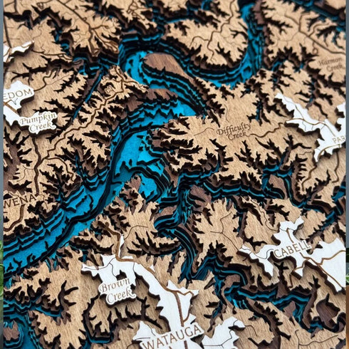 Close up of Lake Cumberland 3D wooden map with blue water layers and coves