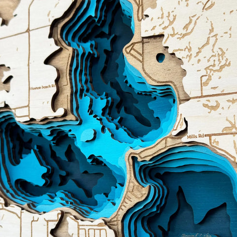 3D layered wooden map of Devil’s Lake Michigan hanging on a wall