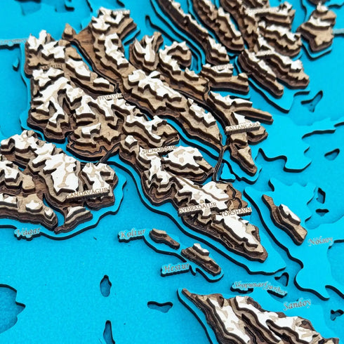 Close up of Faroe Islands wooden map with engraved towns and mountains