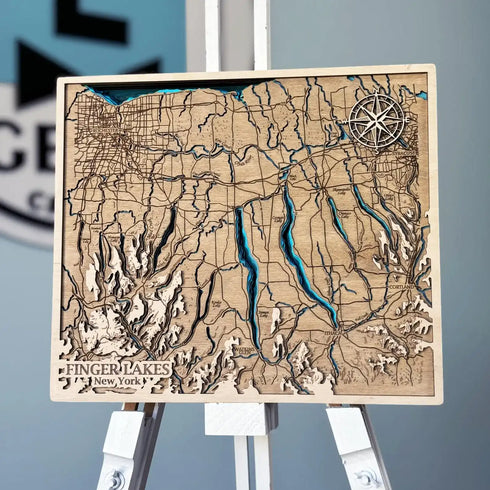 3D wooden map of Finger Lakes New York with compass rose detail