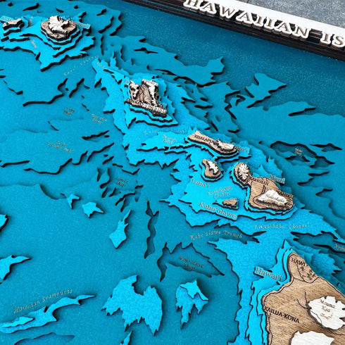 Close up of Hawaiian Islands wooden map with engraved details and water layers