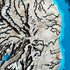Close-up of Kaua’i wooden map with mountain and canyon layers
