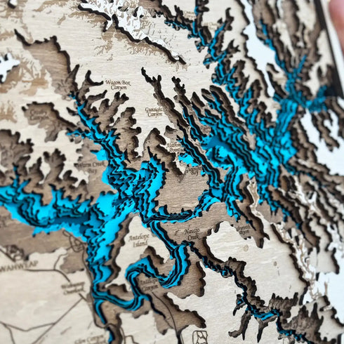 Close-up of Lake Powell wooden map showing canyon and water layers
