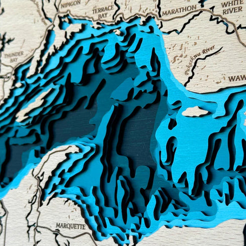 Close-up of handcrafted Lake Superior wood map contours.