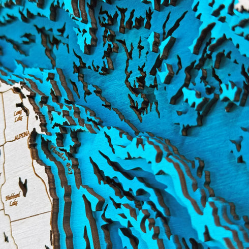 Large round wooden Lake Huron map displayed in modern living room