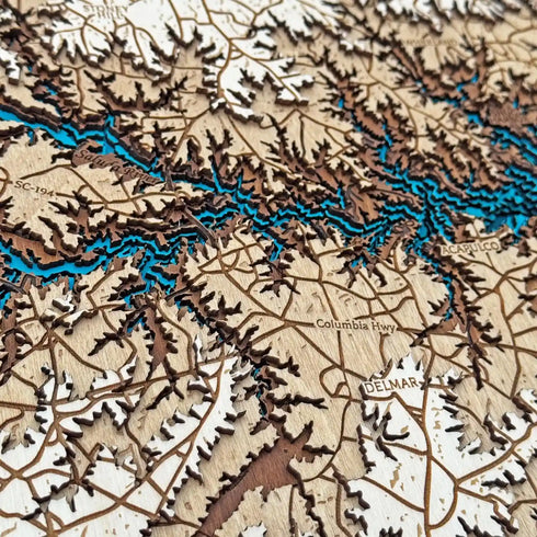 Close up of Lake Murray layered wooden map with blue water design