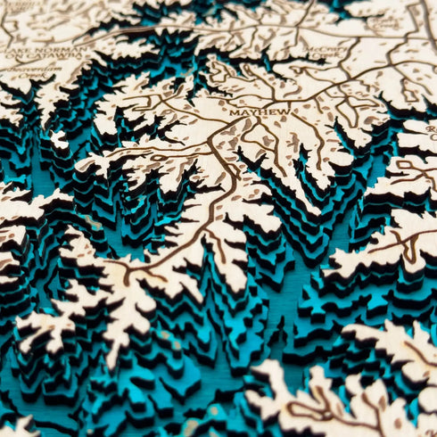 Close up of Lake Norman 3D wooden map with engraved coves and towns