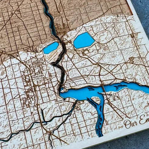Close up of Niagara Falls Canada wooden map with engraved details and river