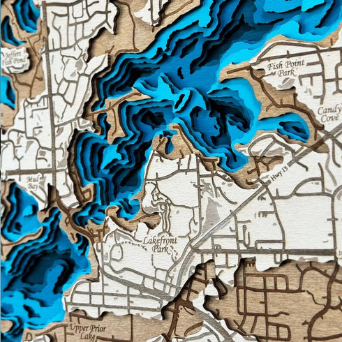 Close-up of Prior Lake wooden wall art showing laser-cut shoreline details