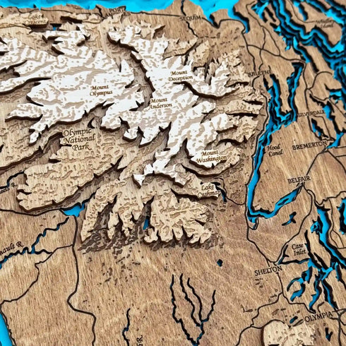 Close up of Puget Sound 3D wooden map with engraved towns and waterways
