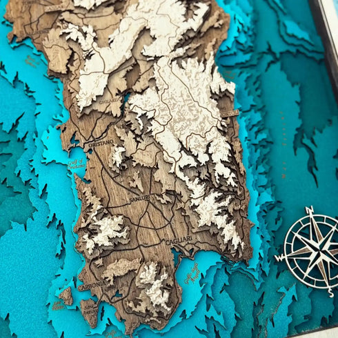 Close-up of Sardinia 3D wooden map highlighting Cagliari and Oristano