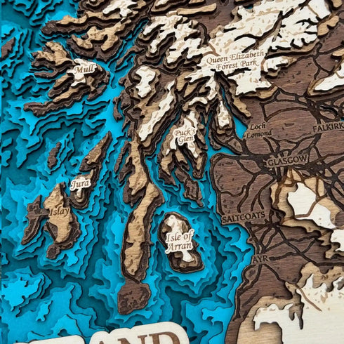 Close up of Scotland 3D wooden map with engraved details of islands and mountains