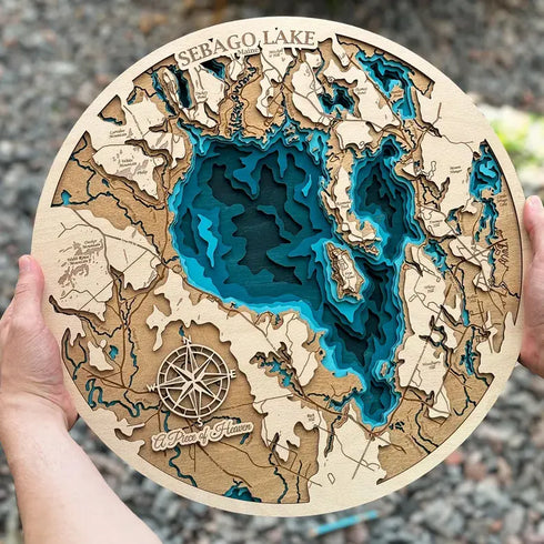 Circular Sebago Lake Maine wooden wall art with detailed water contours