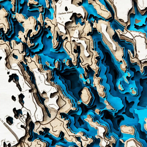 Artistic Six Mile Lake topographic wood wall art, perfect for cottage decor.