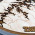 Close-up of laser-cut Table Rock Lake map showing engraved towns and shoreline