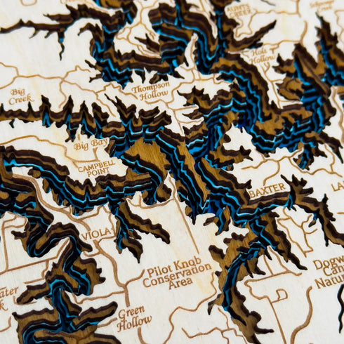 Detailed layered wood artwork of Table Rock Lake with blue water contours