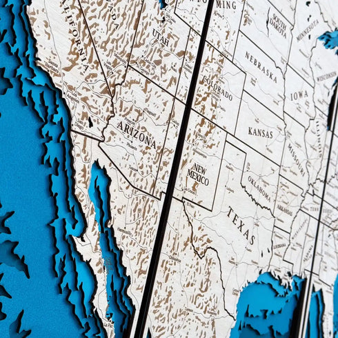 Close up of engraved wooden USA map triptych with state details