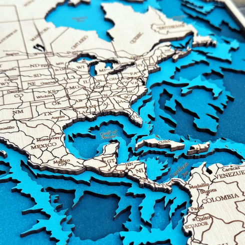 Close up of engraved wooden world map with detailed continents and borders